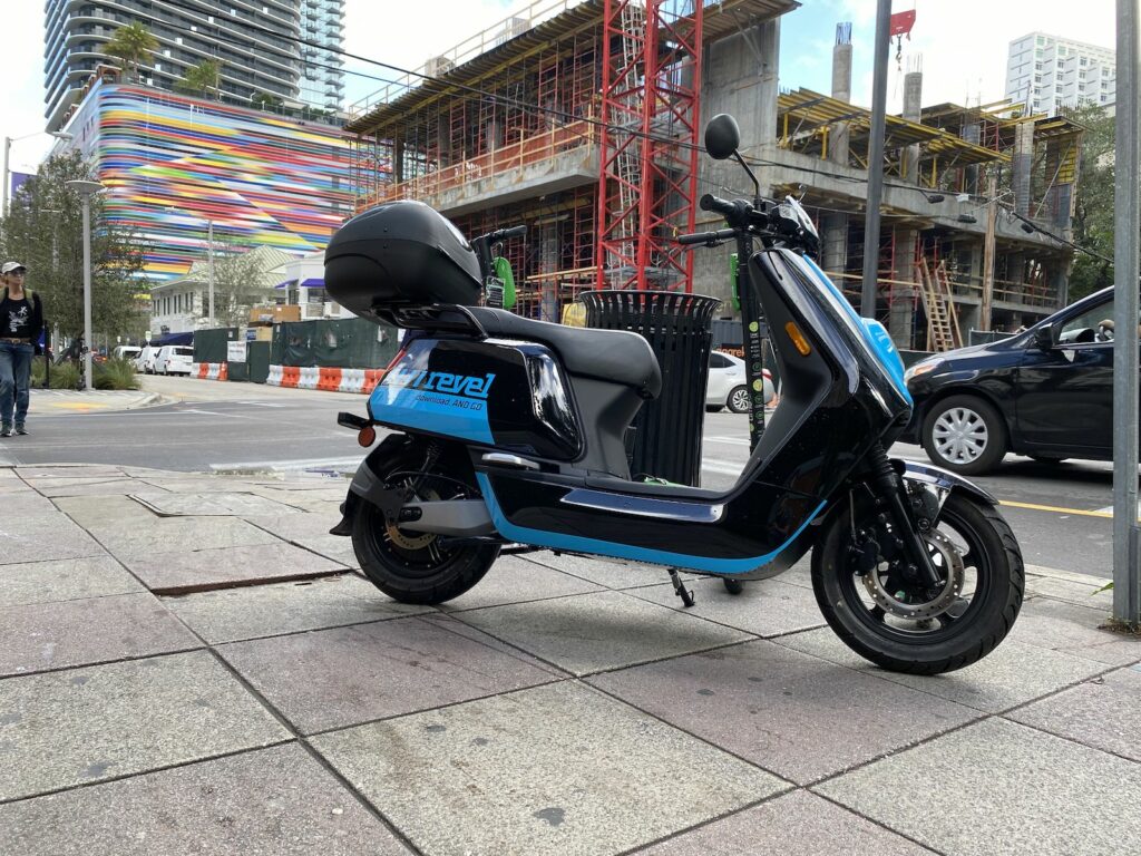 This an image of an electric scooter parked illegally on the sidewalk